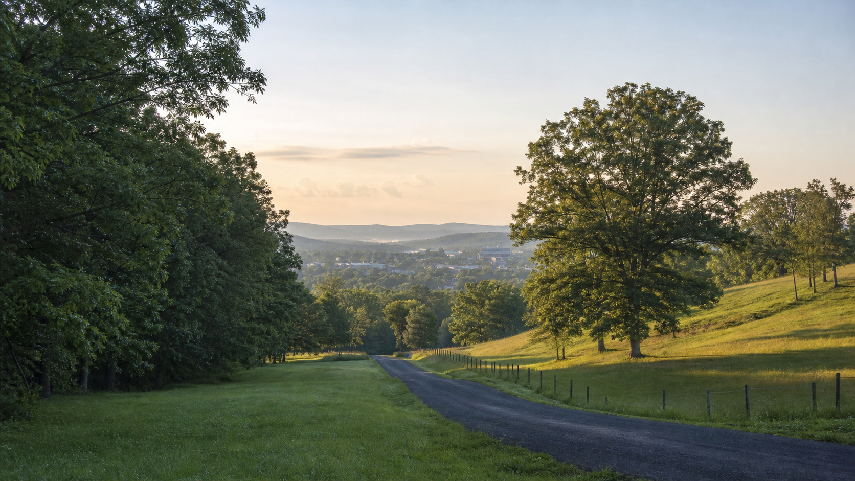 Rolling green hills, mature trees, and a quiet road inspired by the Cookeville area